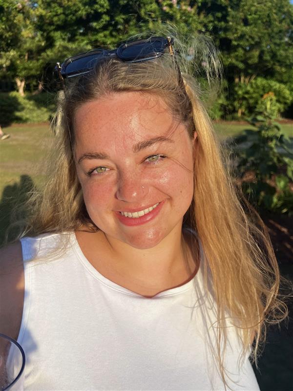 Carly Donnenwirth, a Permit Manager, smiling!